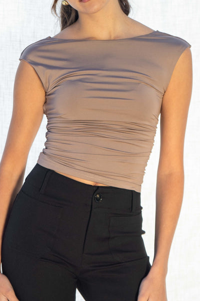 Ashley Square Low Back Top! The high-neck and sleeveless design exudes confidence, while the double layered fabric adds a touch of luxury. The low square back detail is a playful twist on a classic.