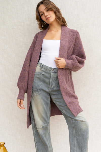 With its oversized fit, it provides a relaxed look while the front pockets add convenience. Made from a soft touch material and featuring bubble sleeves, this cardigan is a must-have for any fashion-forward individual!